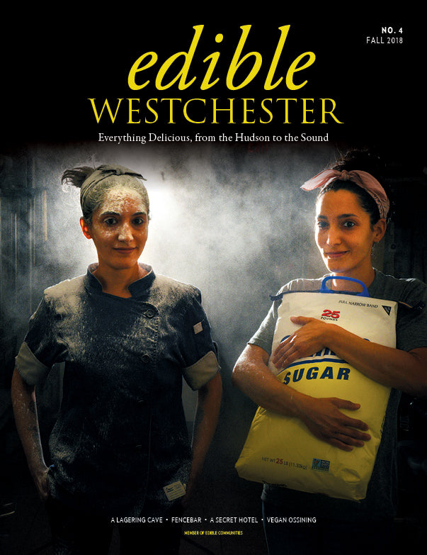 Four issues of Edible Westchester magazine featuring vibrant food photography and local culinary stories.